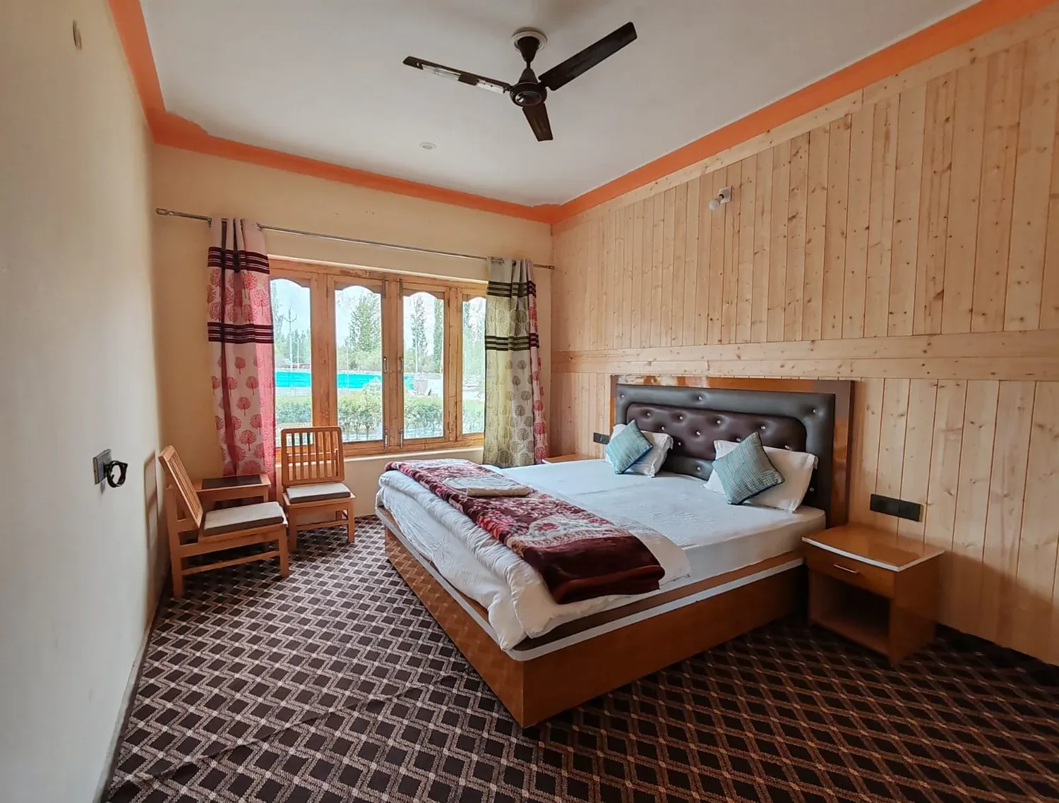 Double Bed Room with wood-panelled wall